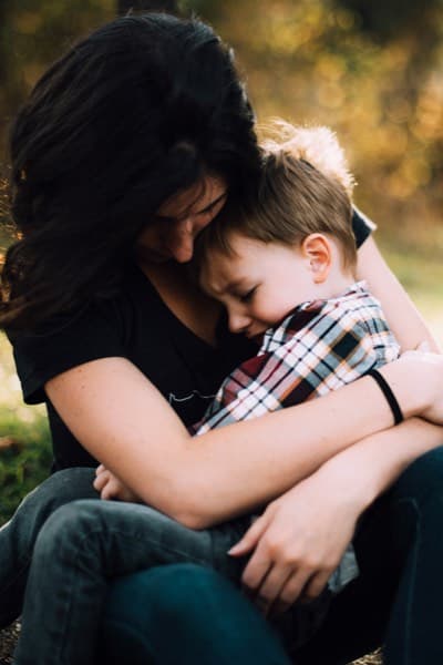 Mother hugging child