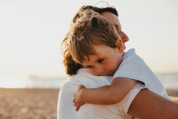 Parent and child on beach